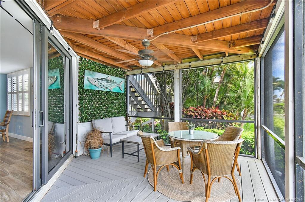 311 Golfview Circle Stuart, FL 34996 - Photo 28 of 37 a patio with yard glass top table and chairs