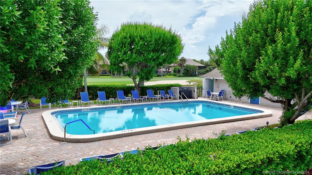 311 Golfview Circle Stuart, FL 34996 - Photo 34 of 37 a view of a swimming pool with a patio
