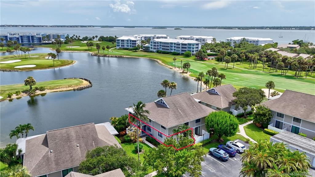 311 Golfview Circle Stuart, FL 34996 - Photo 8 of 37 an aerial view of a house with a swimming pool outdoor seating and yard