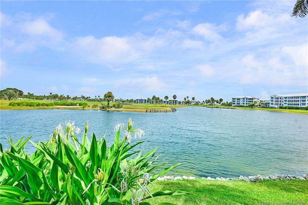 311 Golfview Circle Stuart, FL 34996 - Photo 9 of 37 a view of a lake with a city view
