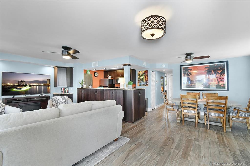 311 Golfview Circle Stuart, FL 34996 - Photo 10 of 37 a living room with furniture and a wooden floor