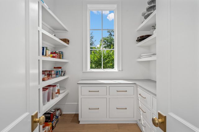 a spacious bedroom with a bed and a window