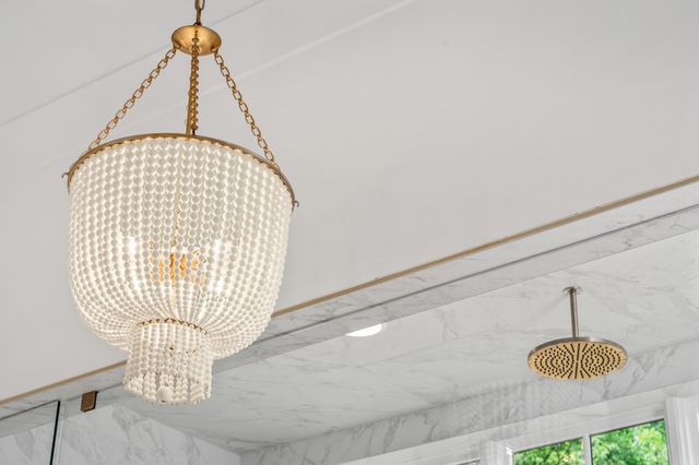 a view of a hallway with chandelier