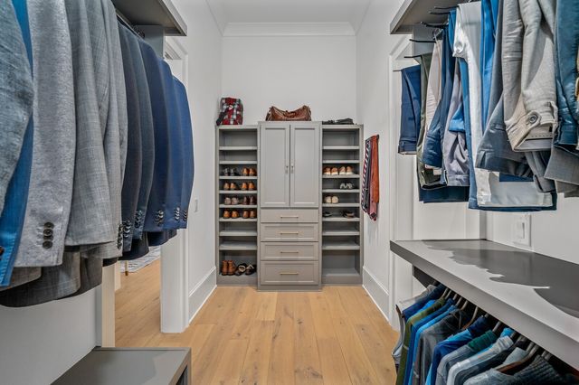 a bathroom with a double vanity sink toilet and a mirror