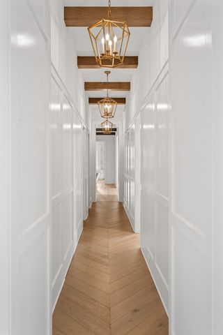 a bathroom with a granite countertop sink toilet and mirror