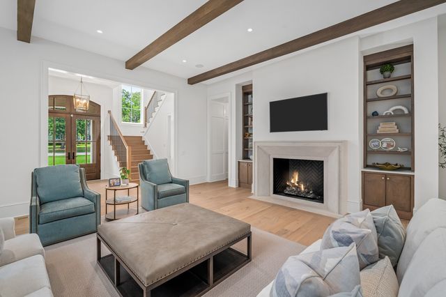 a kitchen with a stove a sink and cabinets