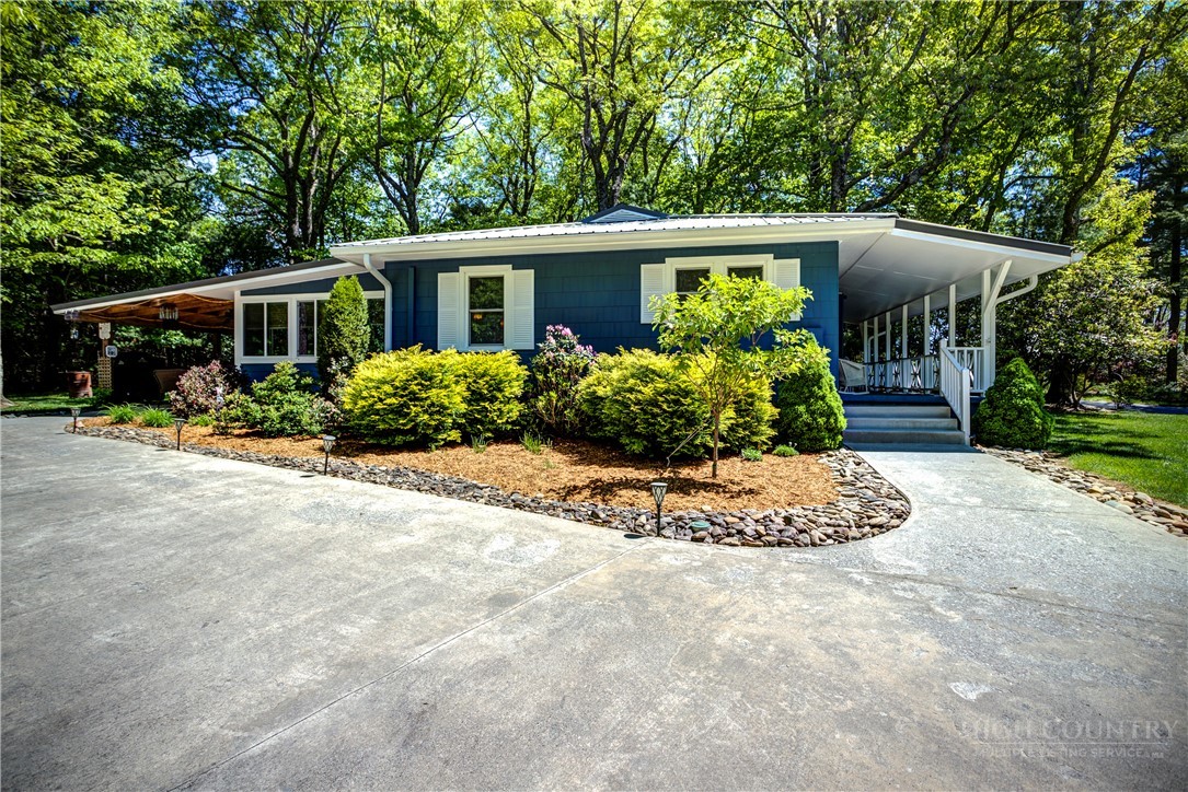1010 Rash Road Glade Valley, NC 28627 - Photo 11 of 50 a front view of house with yard and green space