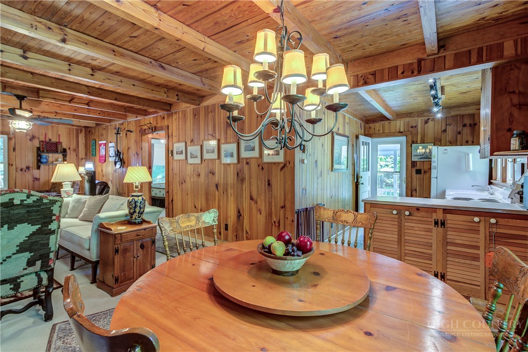 1010 Rash Road Glade Valley, NC 28627 - Photo 21 of 50 a room with furniture and a chandelier