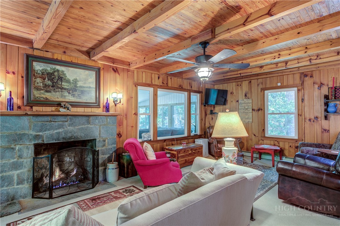 1010 Rash Road Glade Valley, NC 28627 - Photo 30 of 50 a living room with furniture and a fireplace