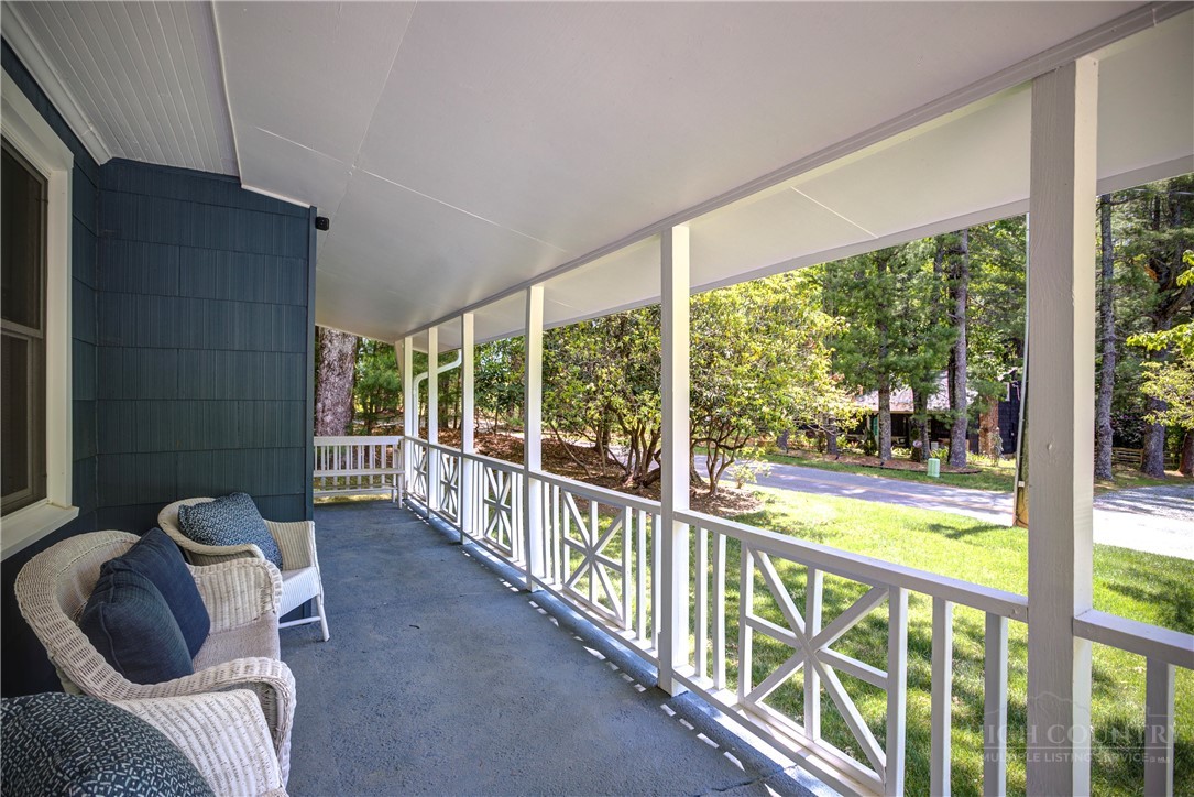 1010 Rash Road Glade Valley, NC 28627 - Photo 50 of 50 a view of a porch with furniture and floor to ceiling window