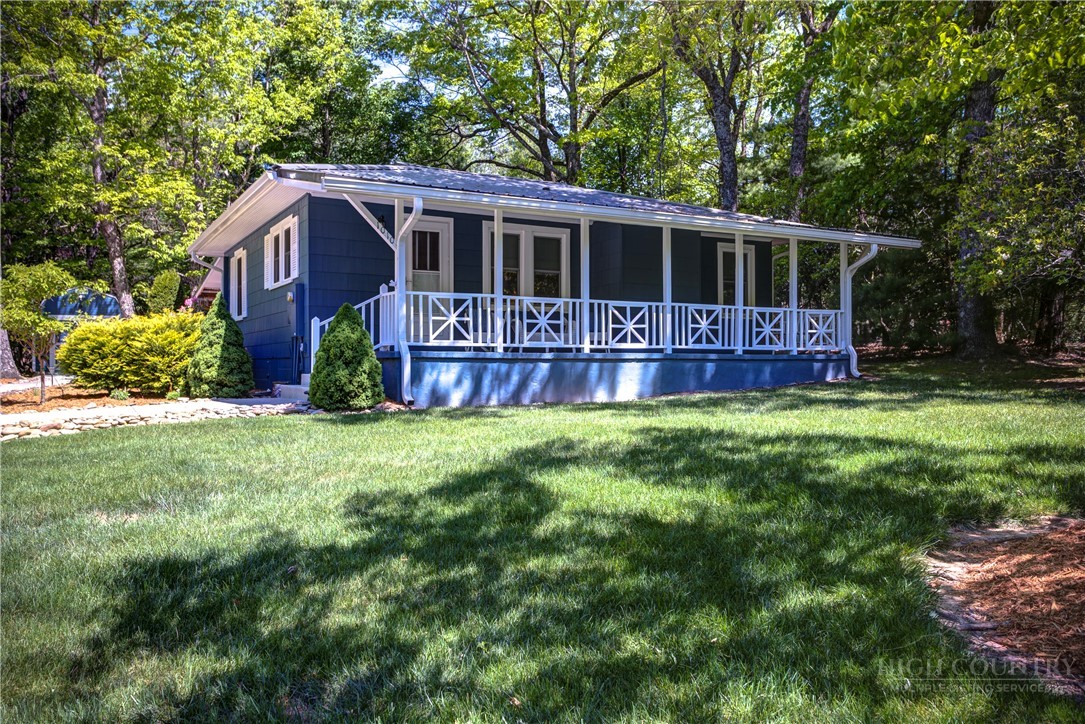 1010 Rash Road Glade Valley, NC 28627 - Photo 5 of 50 a view of house with yard and green space
