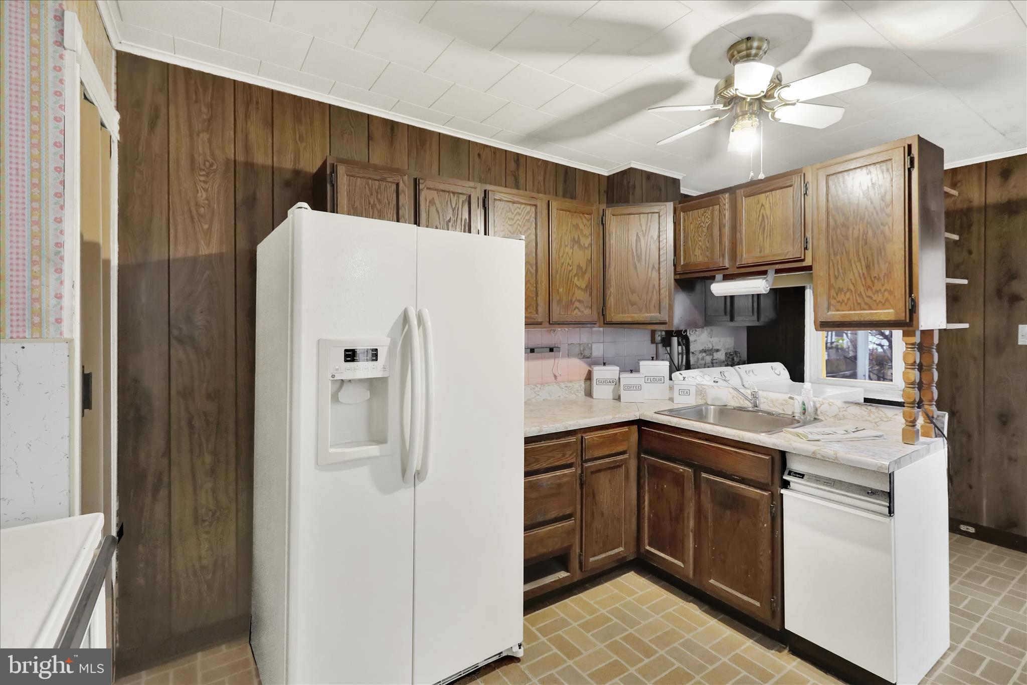 1217 Windsor Street Reading, PA 19604 - Photo 14 of 38 a kitchen with stainless steel appliances a refrigerator and a sink