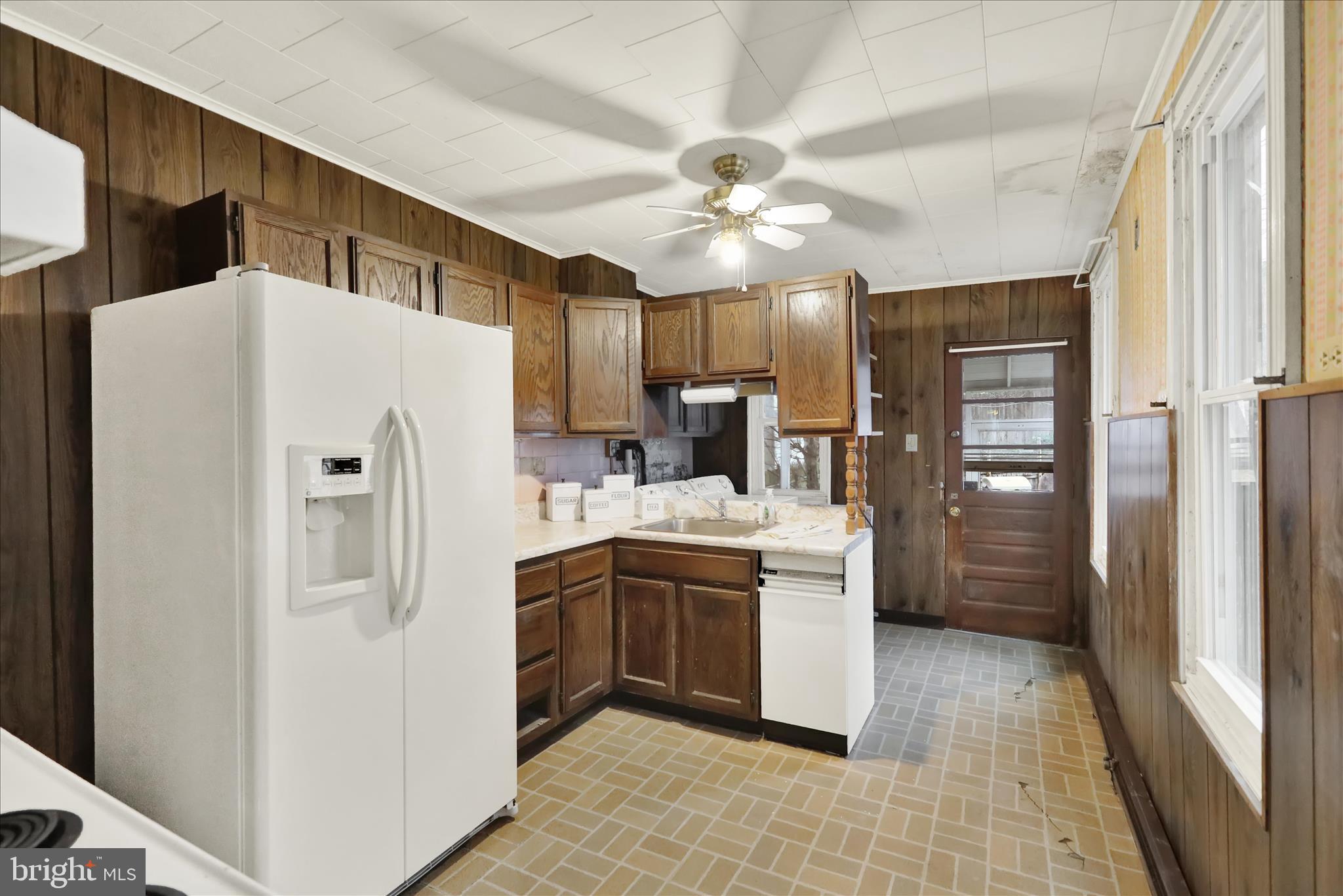 1217 Windsor Street Reading, PA 19604 - Photo 15 of 38 a kitchen with stainless steel appliances granite countertop a refrigerator and a sink