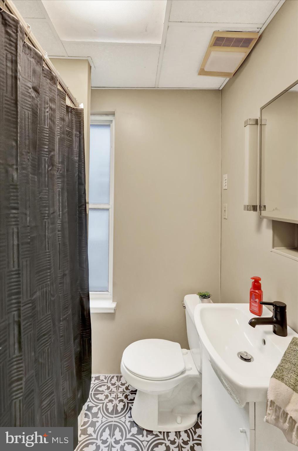 1217 Windsor Street Reading, PA 19604 - Photo 18 of 38 a white toilet sitting next to a bathroom sink