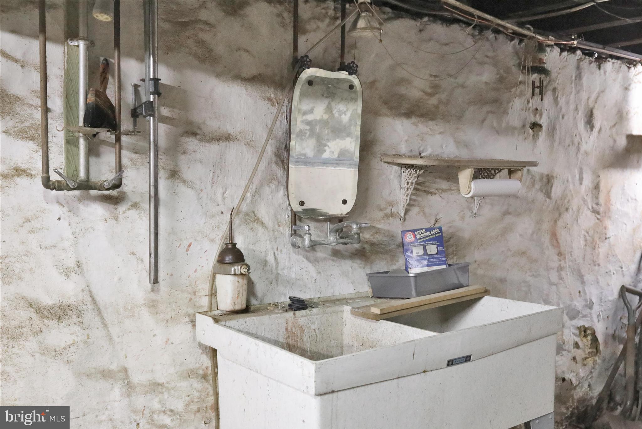 1217 Windsor Street Reading, PA 19604 - Photo 31 of 38 a bathroom with a sink and mirror