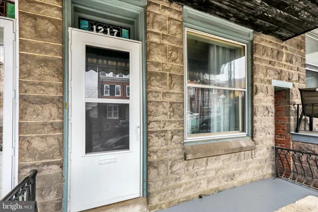 a front view of a house with parking space