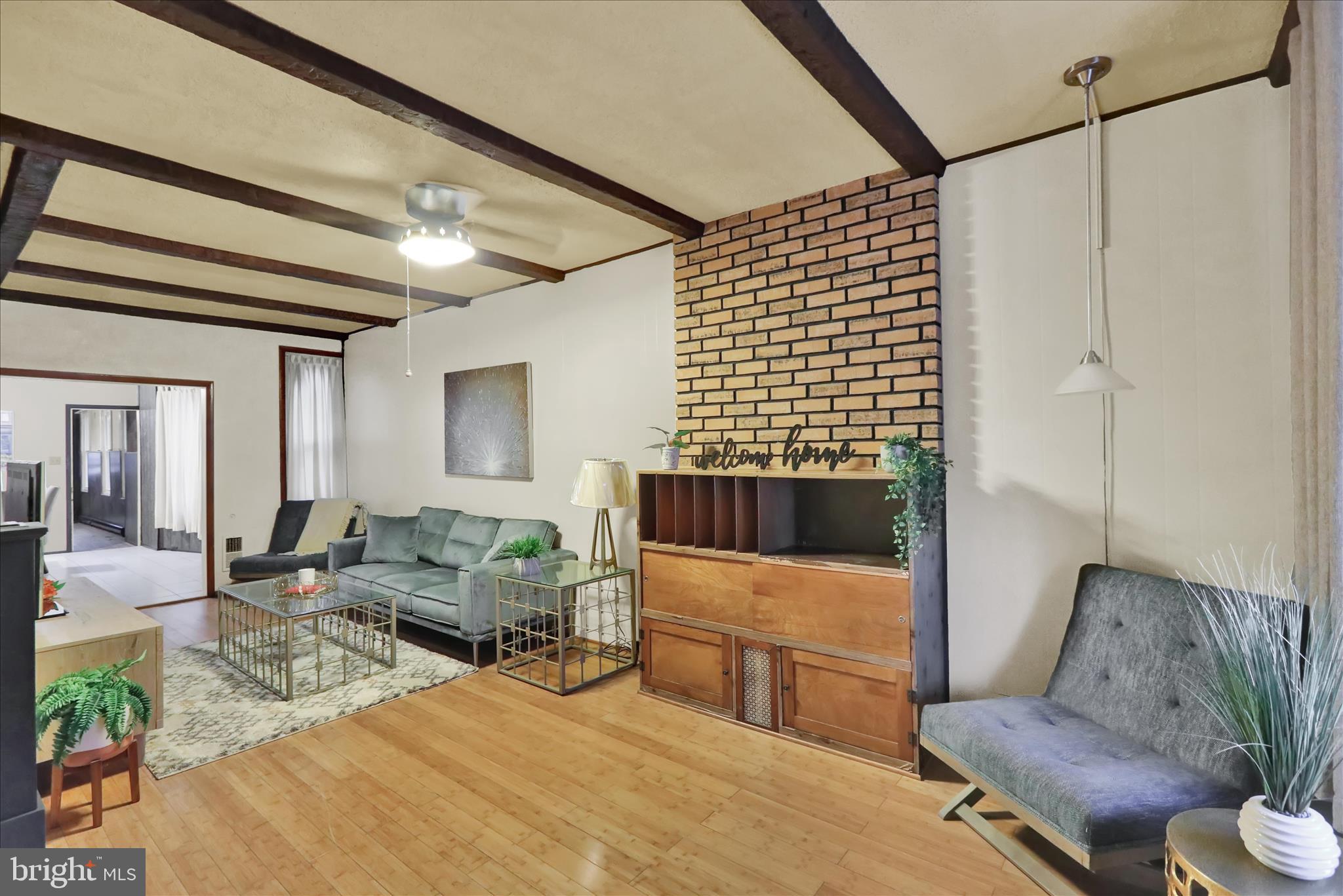 1217 Windsor Street Reading, PA 19604 - Photo 5 of 38 a living room with furniture and a couch