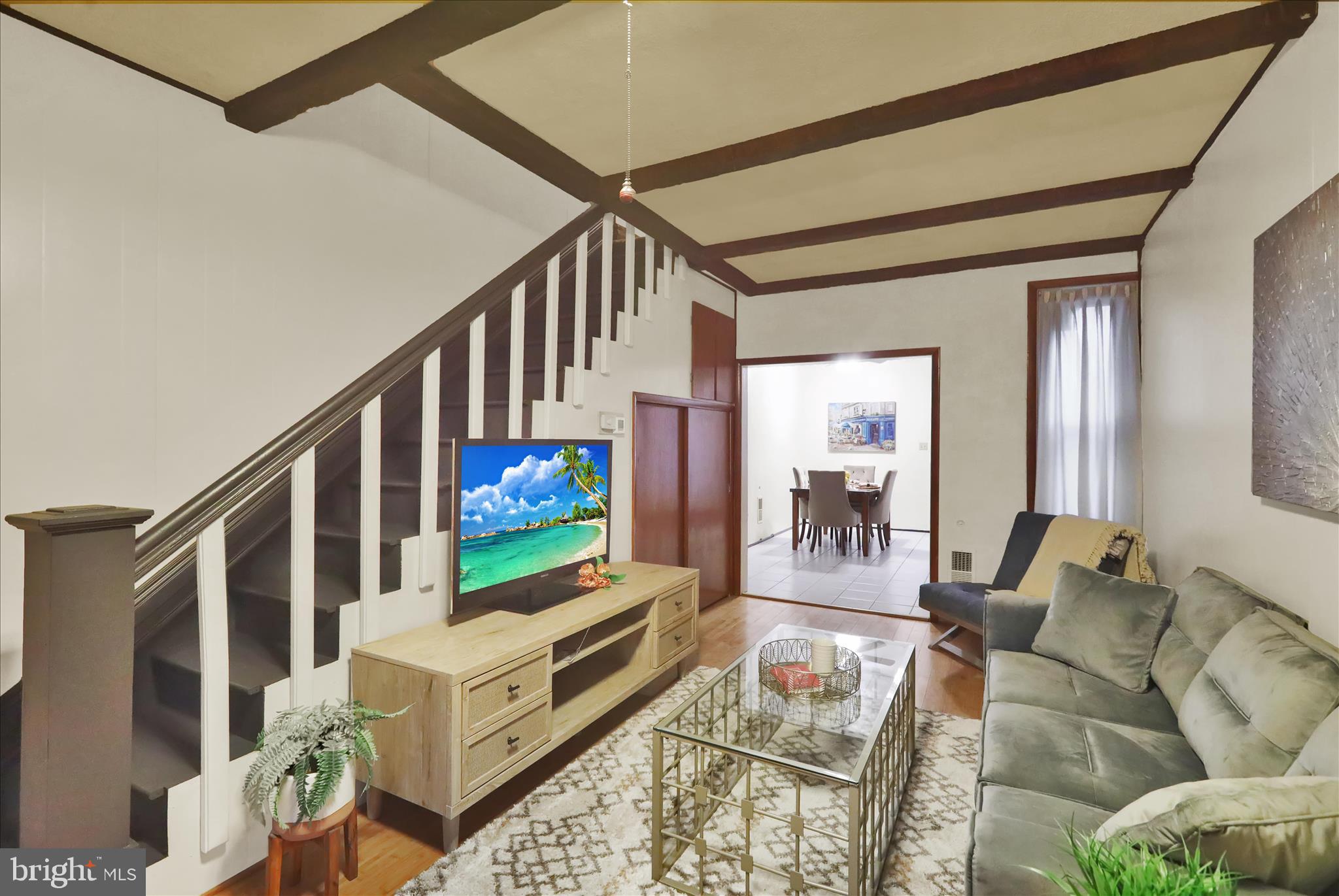 1217 Windsor Street Reading, PA 19604 - Photo 7 of 38 a living room with furniture and a flat screen tv