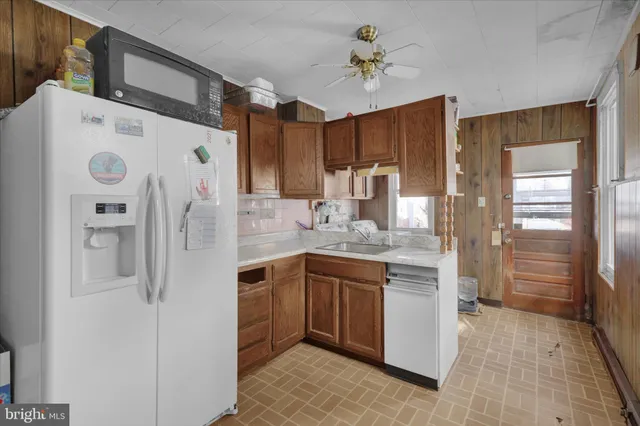 a kitchen with stainless steel appliances a refrigerator and a stove