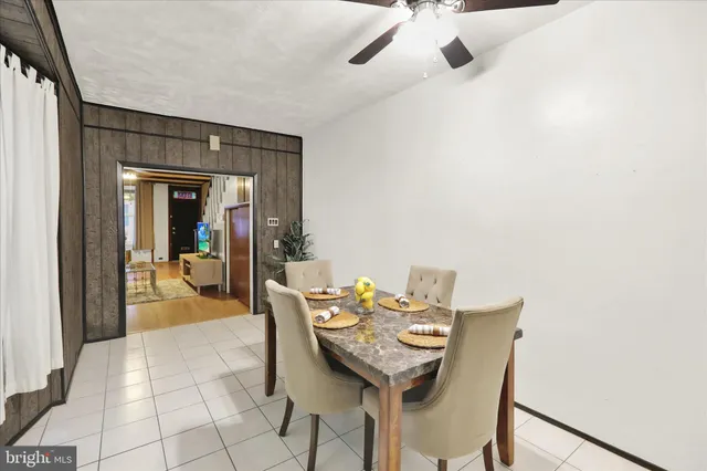 a view of a dining room with furniture and a chandelier