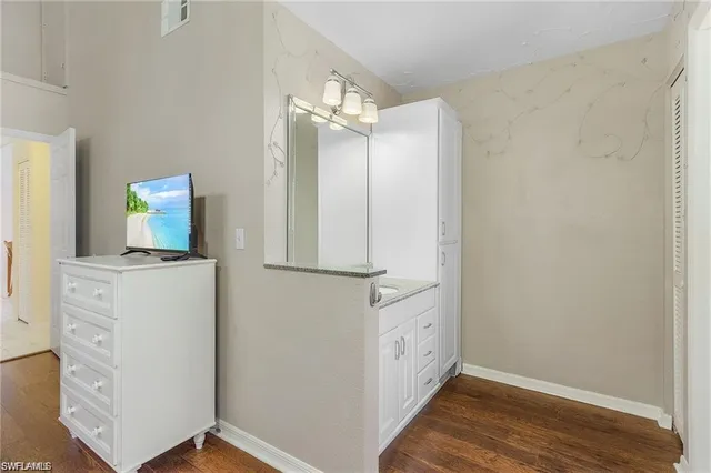 a view of cabinets with wooden floor