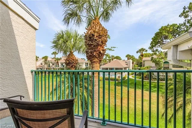 a view of a balcony with lake view and lake view