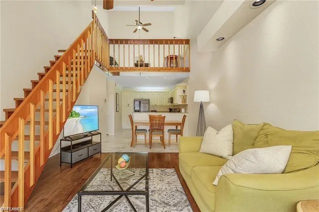a living room with furniture and a rug
