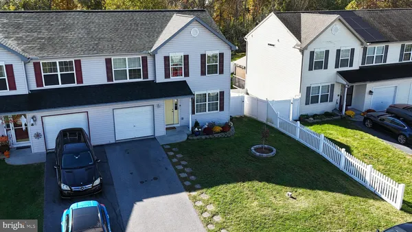 an aerial view of a house with swimming pool garden and patio