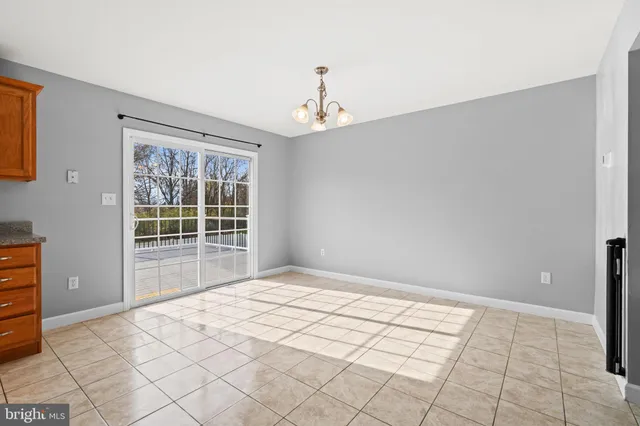 a kitchen with stainless steel appliances granite countertop a sink and a stove