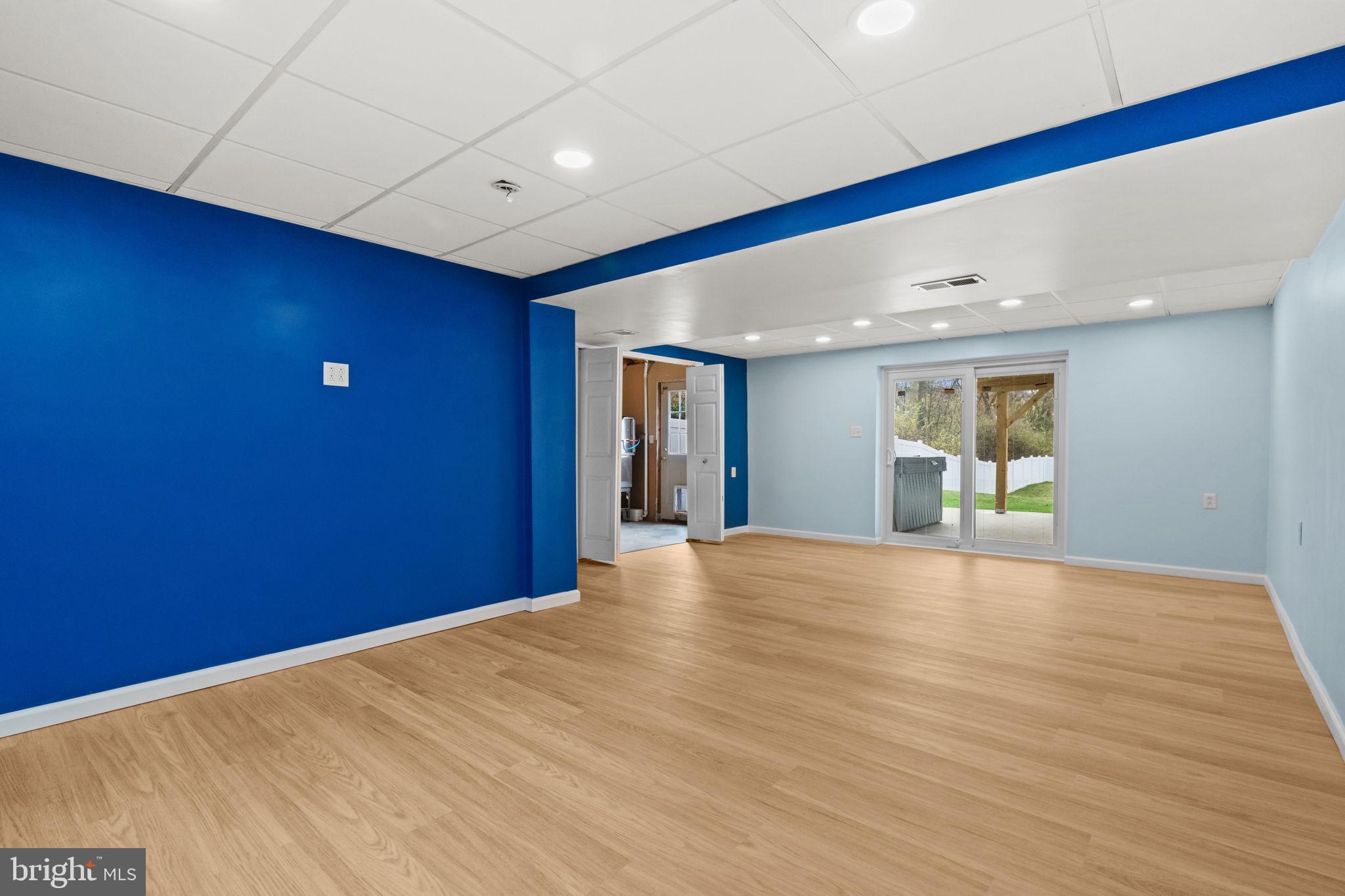 1014 Daisy Drive Temple, PA 19560 - Photo 43 of 83 a view of an empty room with wooden floor and windows