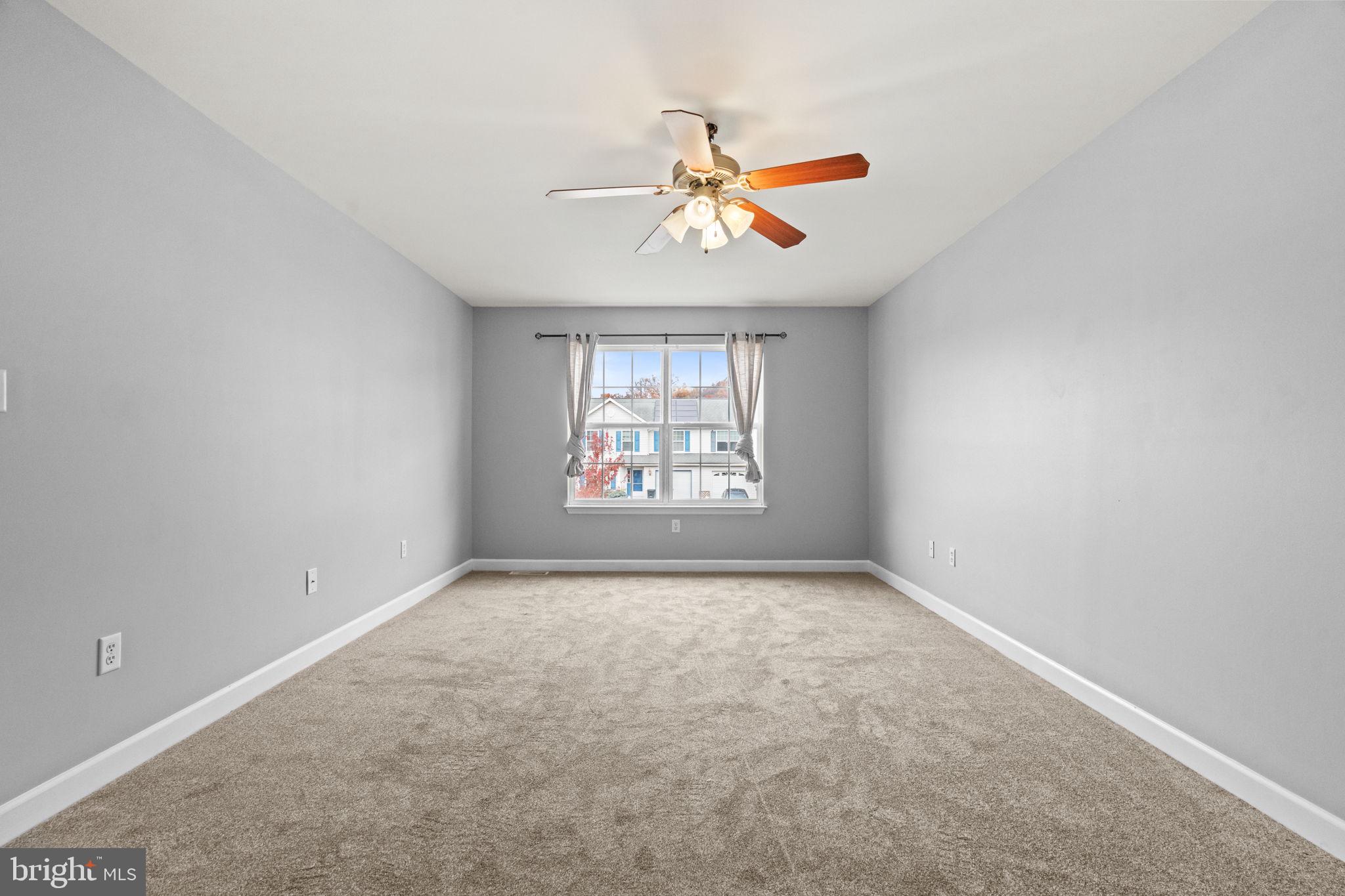 1014 Daisy Drive Temple, PA 19560 - Photo 56 of 83 an empty room with windows and fan