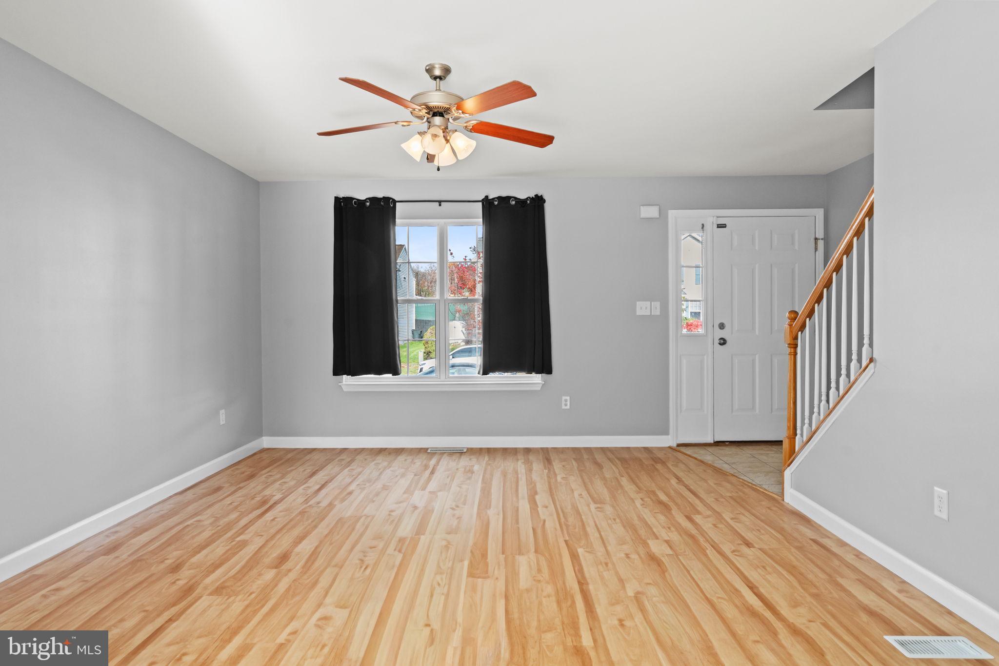 1014 Daisy Drive Temple, PA 19560 - Photo 6 of 83 wooden floor in an empty room with a window