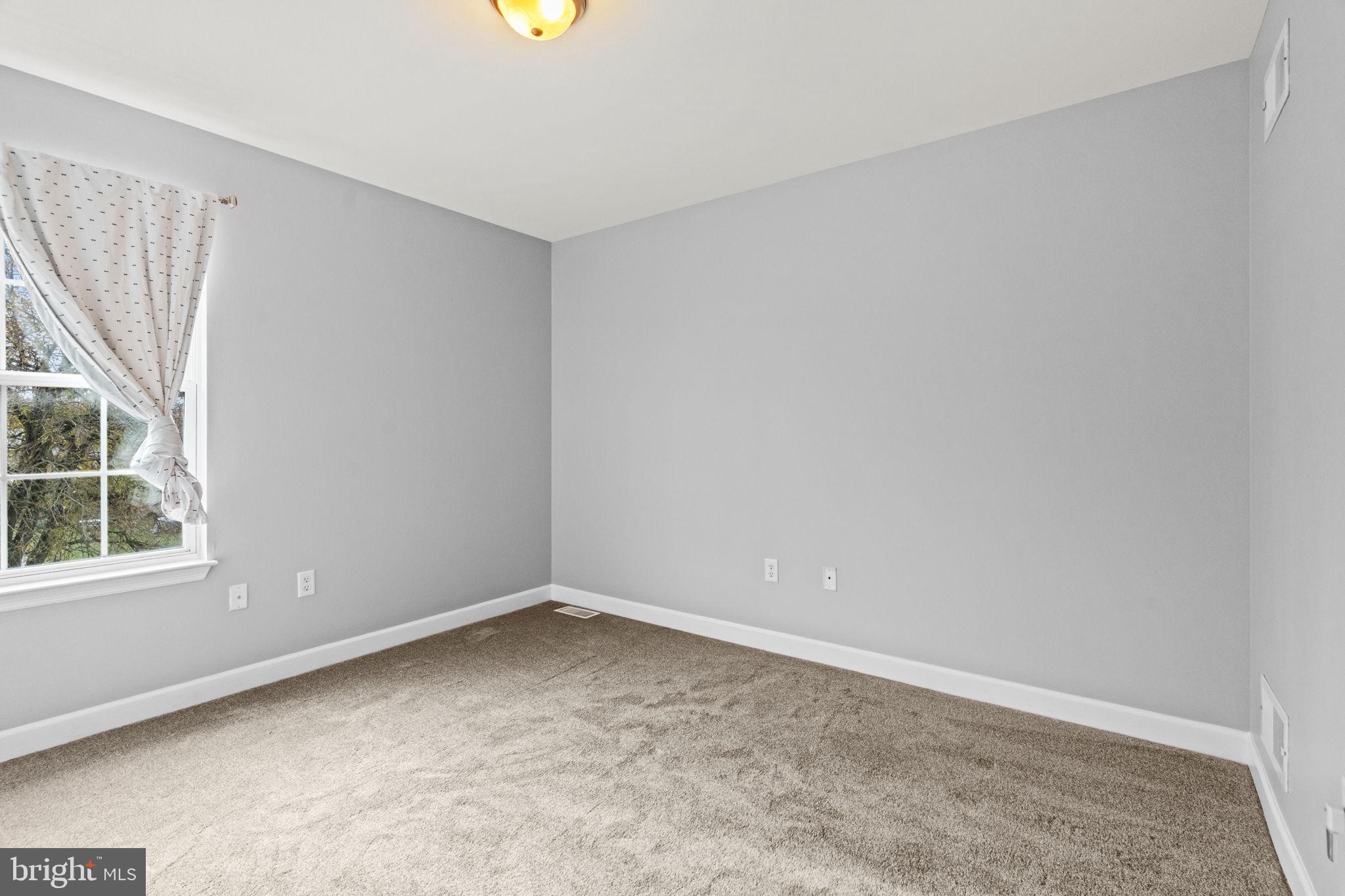 1014 Daisy Drive Temple, PA 19560 - Photo 67 of 83 an empty room with windows
