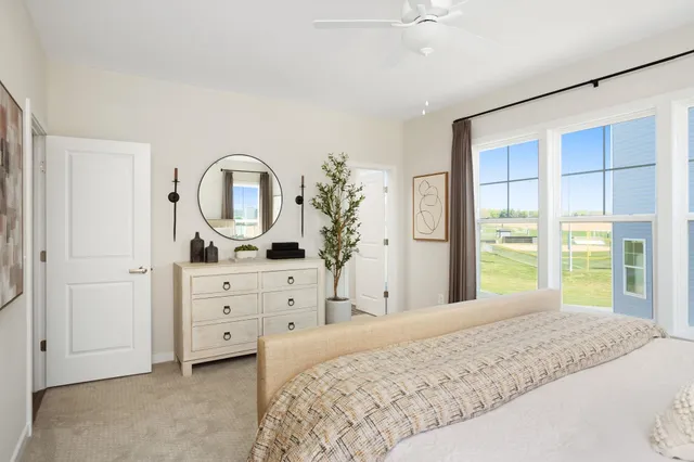 a bedroom with a bed and a dresser