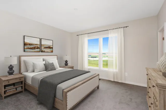 a bed room with a bed and a window