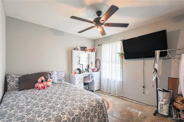 a bedroom with a bed and a cabinets
