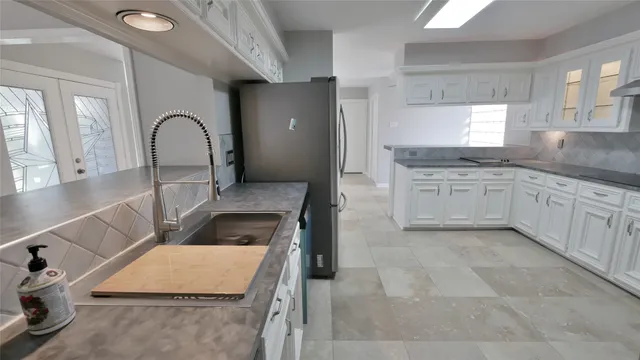 a bathroom with a glass shower door