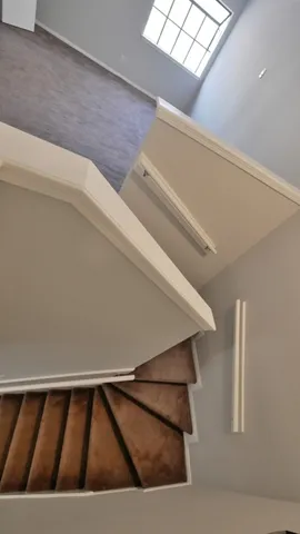 a view of a house with pool and chairs