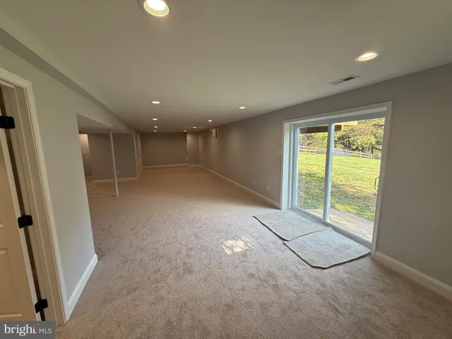 a view of stairs with wooden floor and a yard