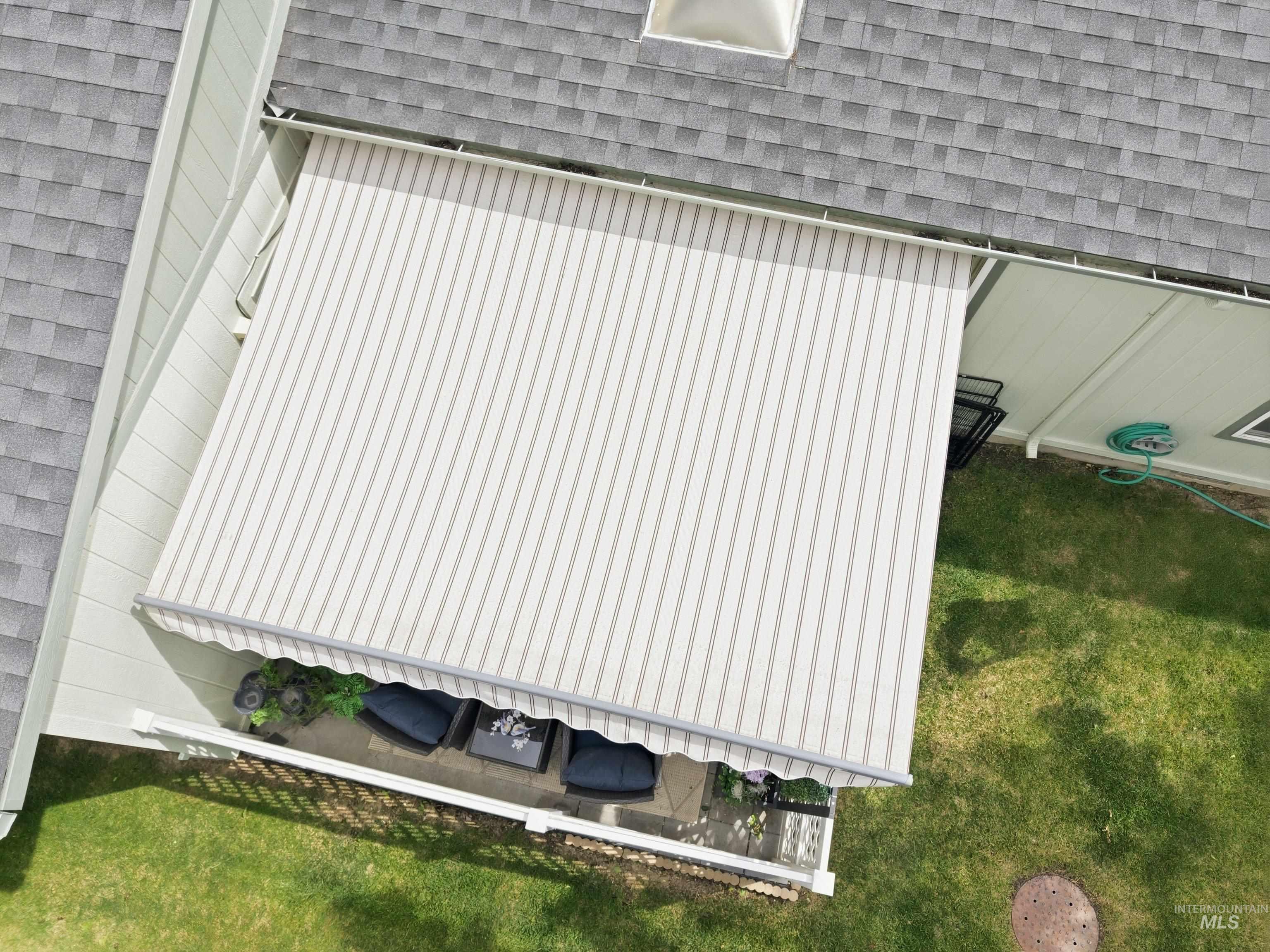421 South Curtis Road, Unit 202 202 Boise, ID 83705 - Photo 38 of 41 Retractable striped awning extending over a patio with outdoor seating