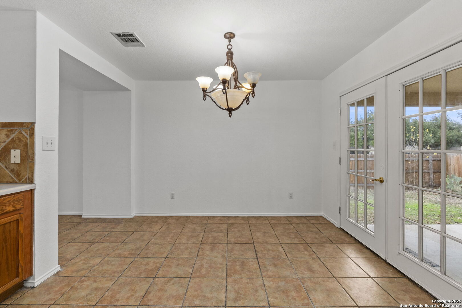620 Waterleaf Boulevard Kyle, TX 78640 - Photo 11 of 34 a view of empty room with wooden floor