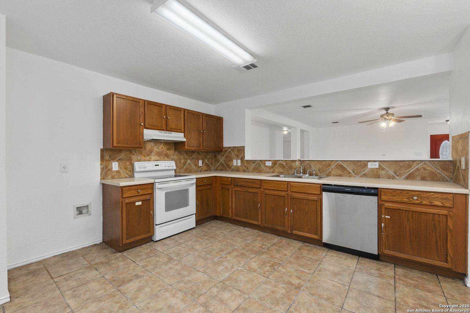 620 Waterleaf Boulevard Kyle, TX 78640 - Photo 14 of 34 a large kitchen with stainless steel appliances granite countertop a stove and a sink
