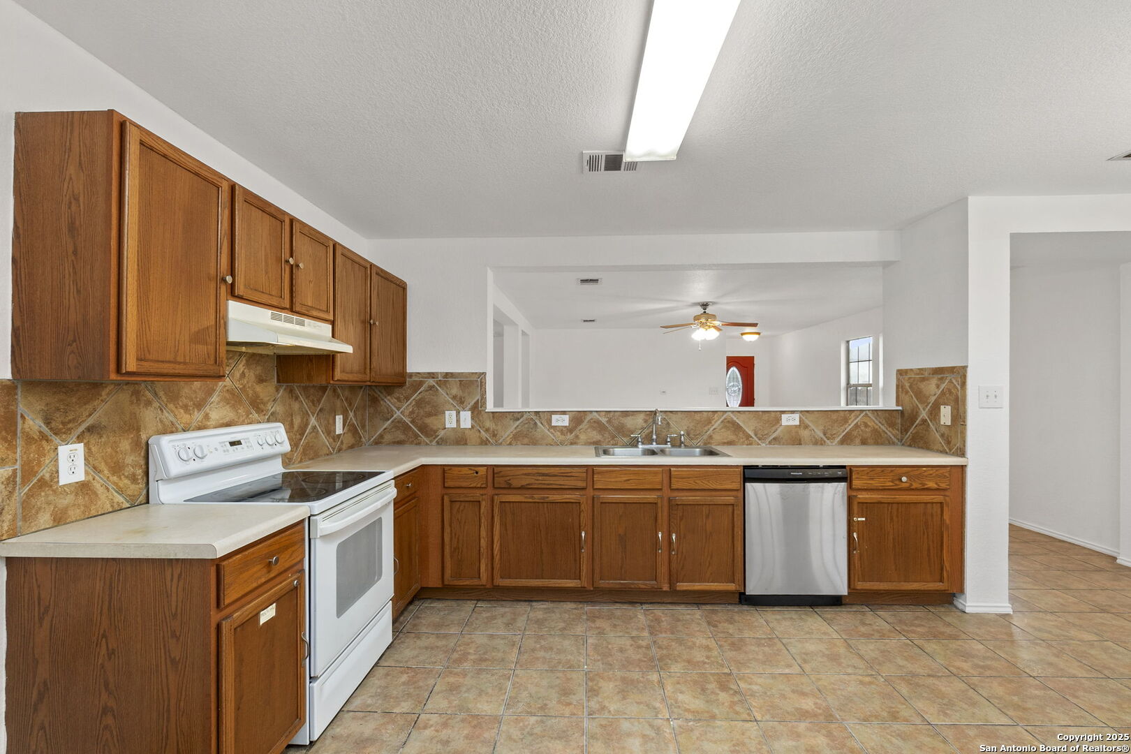 620 Waterleaf Boulevard Kyle, TX 78640 - Photo 15 of 34 a kitchen with stainless steel appliances a sink and cabinets