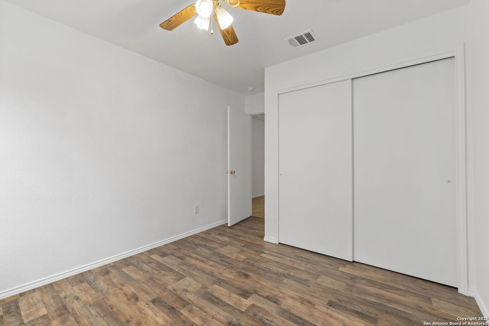 620 Waterleaf Boulevard Kyle, TX 78640 - Photo 17 of 34 a view of an empty room with wooden floor