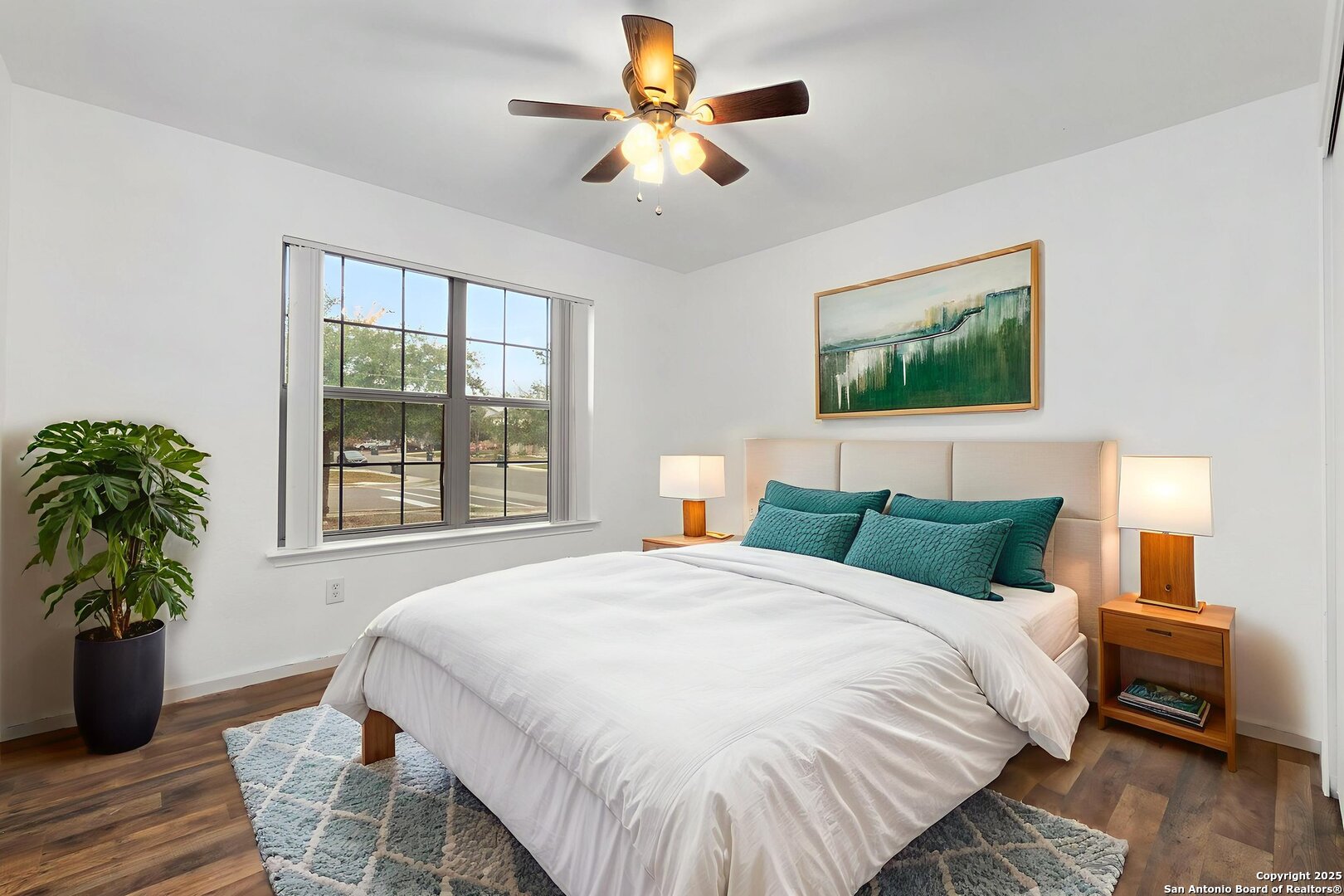 620 Waterleaf Boulevard Kyle, TX 78640 - Photo 19 of 34 a bedroom with bed and a potted plant