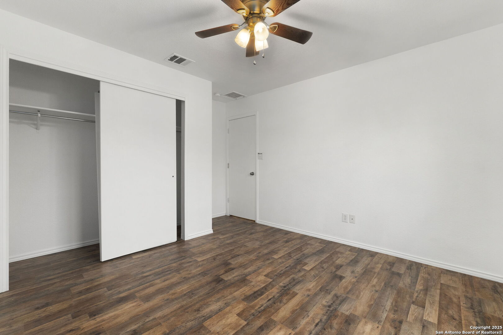 620 Waterleaf Boulevard Kyle, TX 78640 - Photo 20 of 34 wooden floor in an empty room with a window