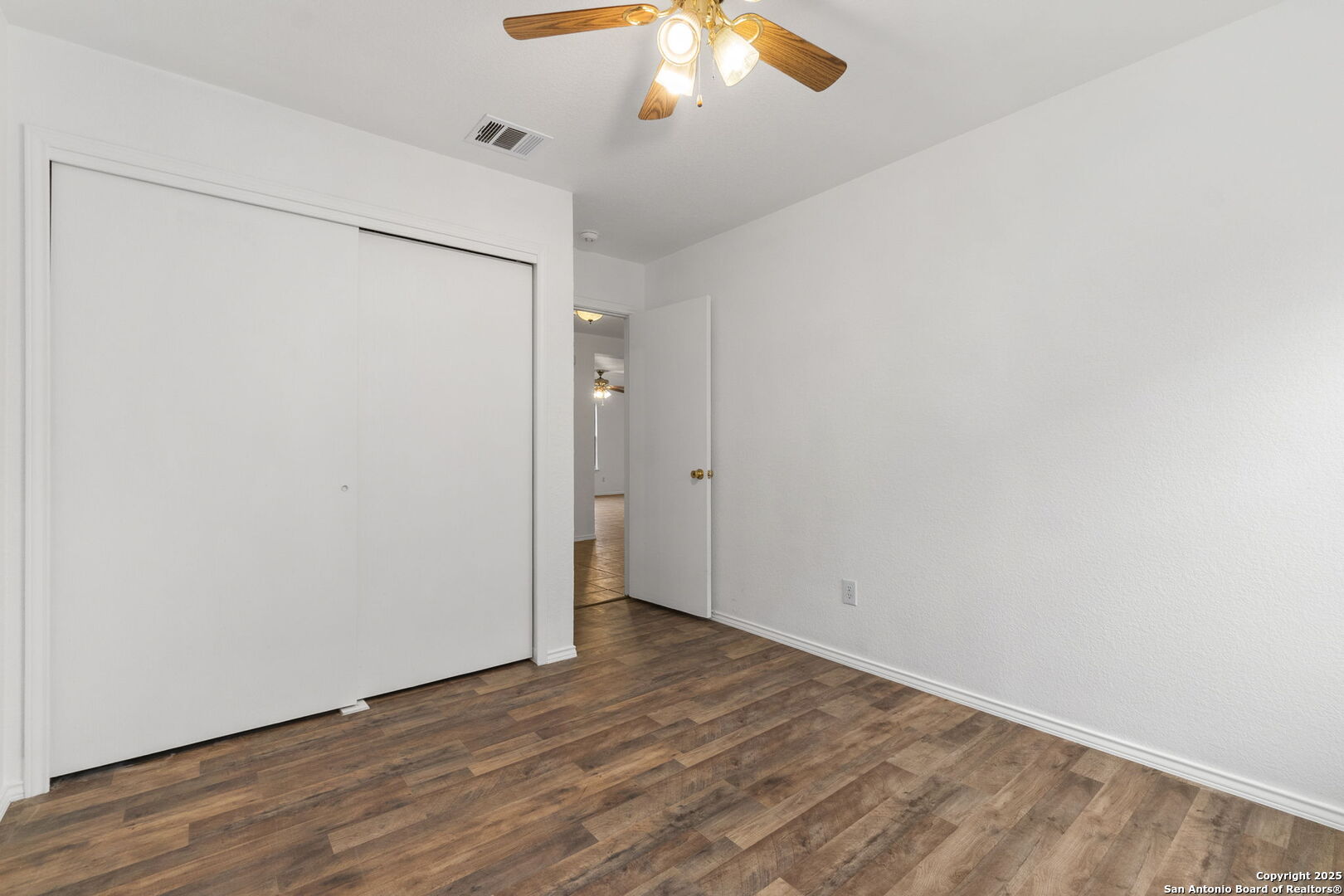 620 Waterleaf Boulevard Kyle, TX 78640 - Photo 21 of 34 a view of an empty room with wooden floor