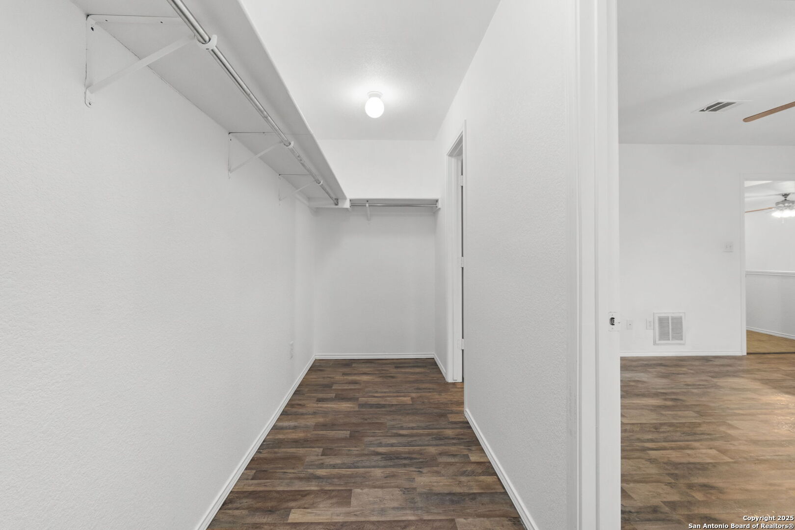 620 Waterleaf Boulevard Kyle, TX 78640 - Photo 22 of 34 a view of a hallway with wooden floor