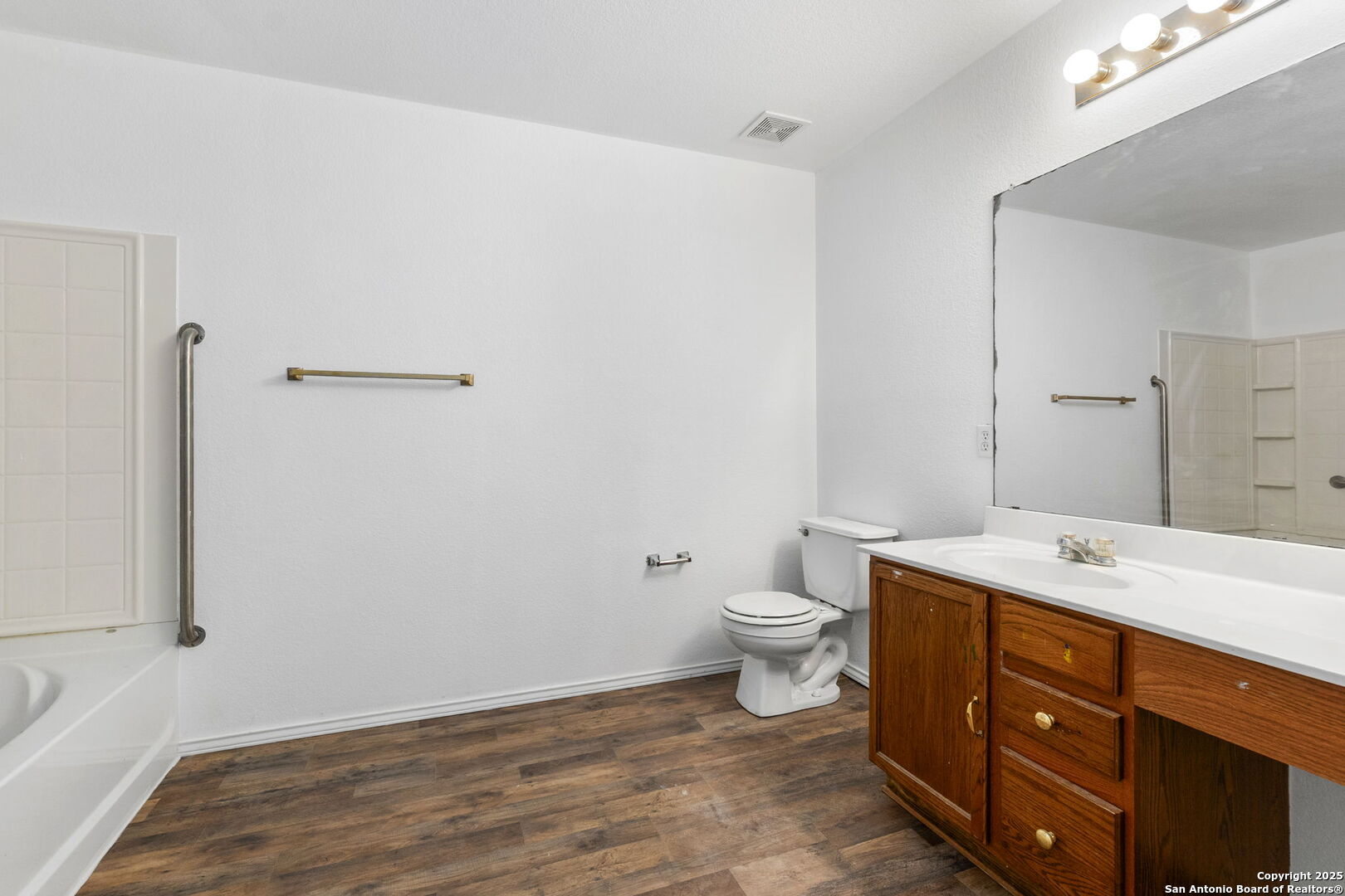 620 Waterleaf Boulevard Kyle, TX 78640 - Photo 25 of 34 a bathroom with a sink a toilet and a mirror