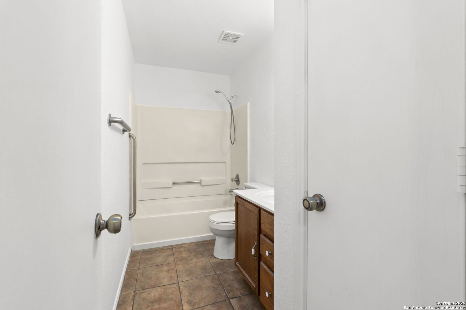 620 Waterleaf Boulevard Kyle, TX 78640 - Photo 29 of 34 a bathroom with a granite countertop bathtub shower sink and toilet
